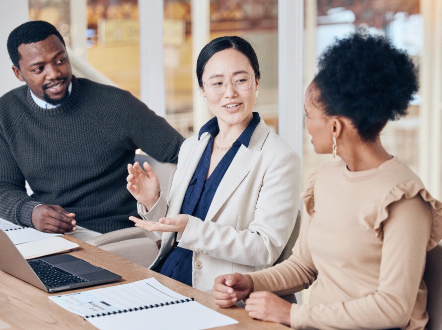 Teamwork, planning and laptop with business people in office for consulting, coaching and feedback